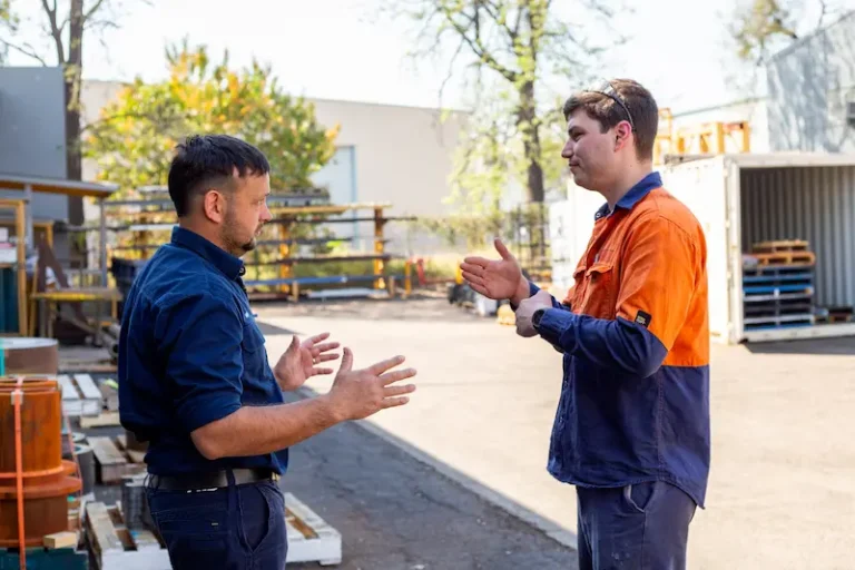 Two ABCO Precision Machining employees discussing a job for a client