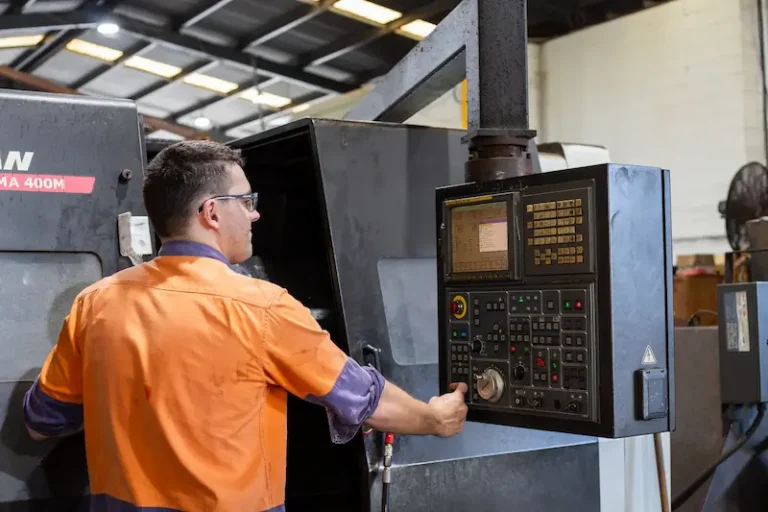 ABCO Precision Machining machine operator working on a CNC milling machine